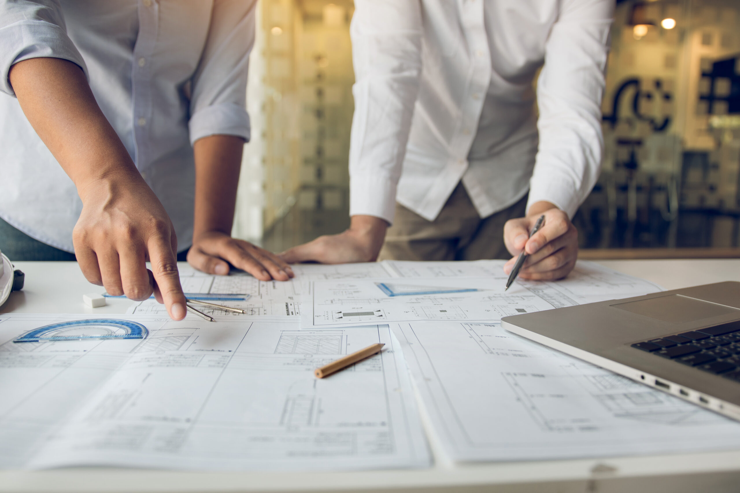Engineers are helping to design work on blueprints and collabora